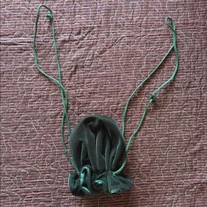 Small drawstring green velvet pouch